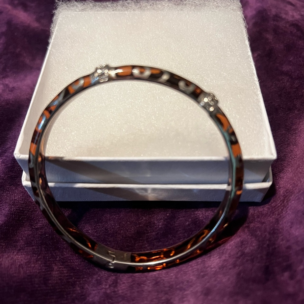 Womens bracelet. Color: Deep tan/ brown with diamondesque accent. Beautiful!!